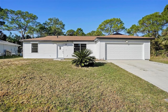 ranch-style home with a garage and a front lawn