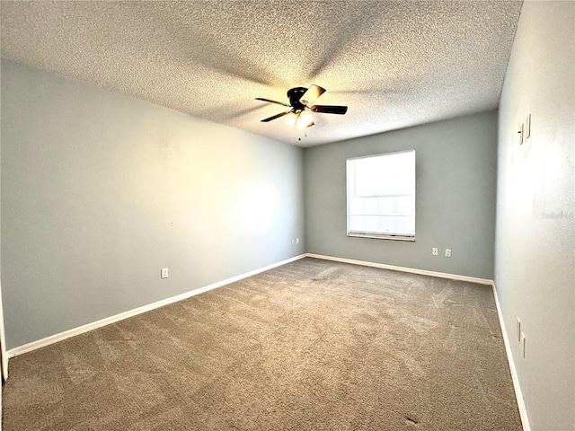 unfurnished room featuring ceiling fan, carpet, and a textured ceiling