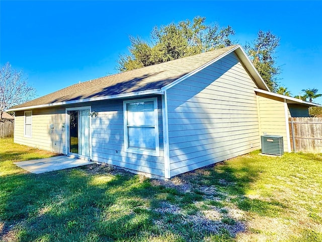 view of home's exterior featuring a yard and central air condition unit