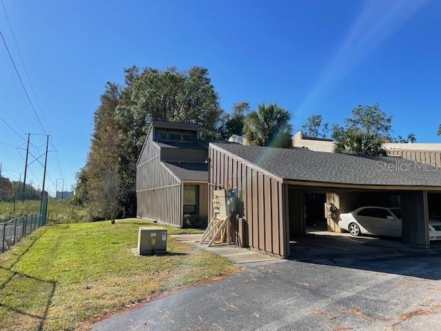 5466 Pine Creek Dr Unit 2002, Orlando, FL 32811 - view of front of property featuring board and batten siding