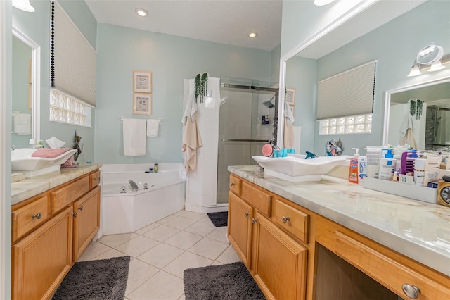 bathroom featuring tile patterned flooring, plus walk in shower, and vanity