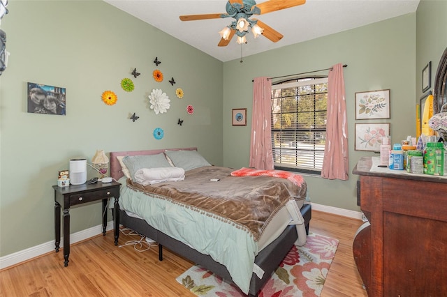 bedroom featuring ceiling fan and light wood-type flooring