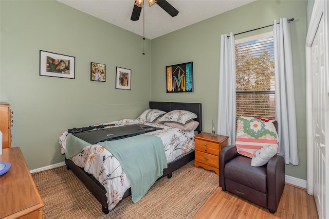 bedroom featuring ceiling fan and light hardwood / wood-style flooring