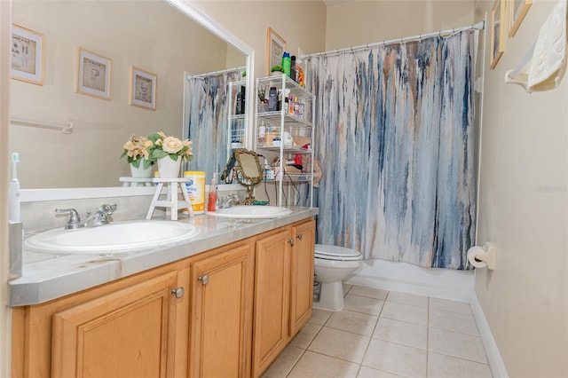 full bathroom featuring tile patterned flooring, shower / bath combination with curtain, vanity, and toilet