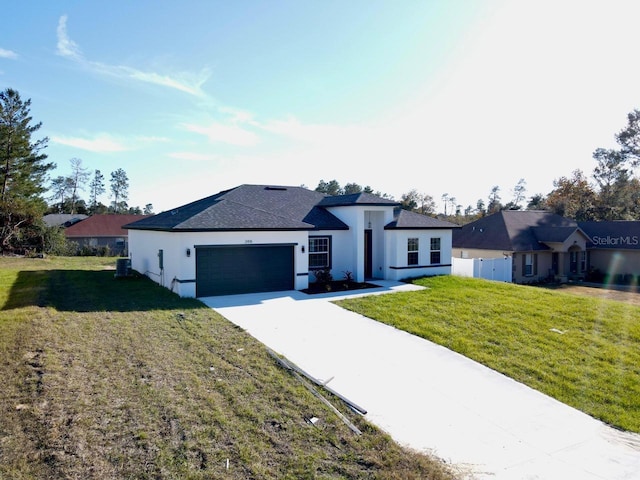 2416 SW 158th Pl, Ocala, FL 34473 - view of front of home with an attached garage, driveway, stucco siding, and cooling unit