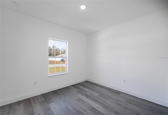 2416 SW 158th Pl, Ocala, FL 34473 - empty room with dark wood-style flooring, baseboards, and recessed lighting
