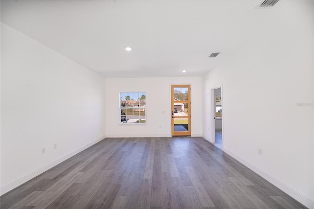 unfurnished living room featuring dark wood-type flooring