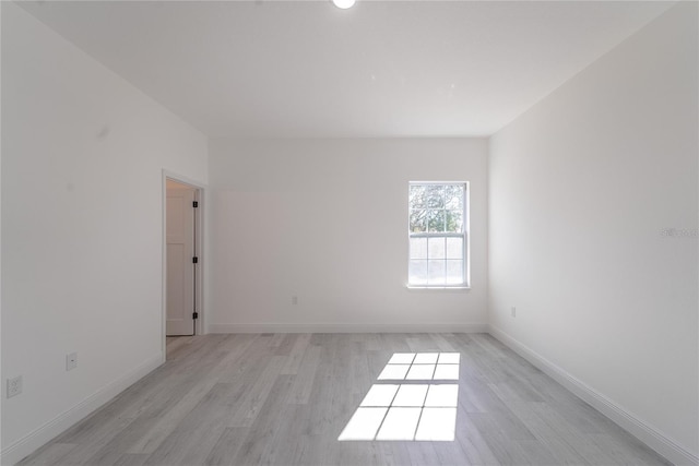 empty room with light hardwood / wood-style floors