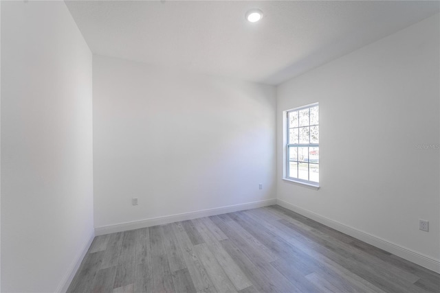 spare room featuring light hardwood / wood-style floors