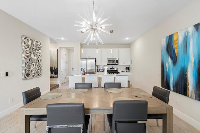 dining room with light tile patterned floors and an inviting chandelier