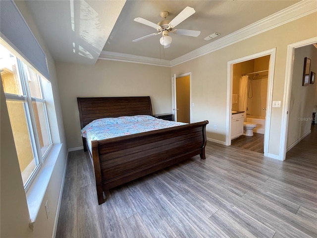 bedroom with ensuite bathroom, ceiling fan, wood-type flooring, and ornamental molding