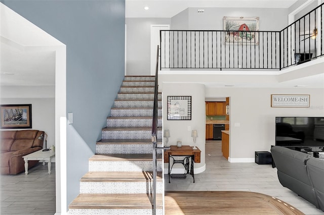 stairway featuring hardwood / wood-style floors