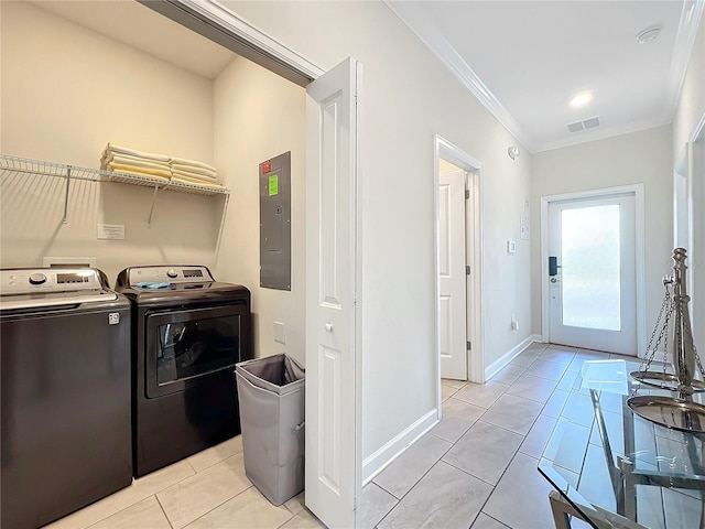 laundry area with washer and dryer, light tile patterned floors, electric panel, and crown molding