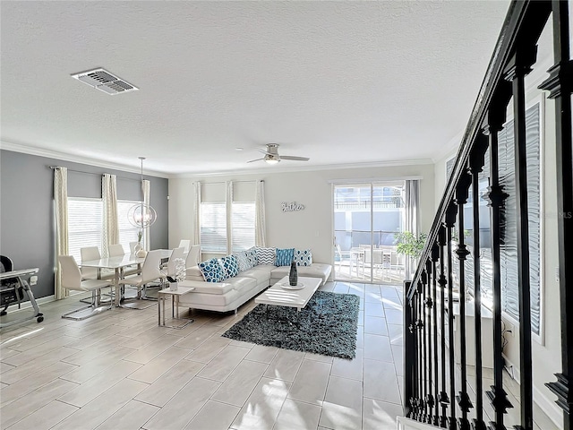 1264 Challenge Dr, Davenport, FL 33896 - living area with crown molding, plenty of natural light, ceiling fan, baseboards, and a textured ceiling