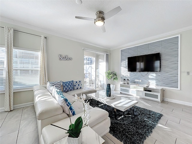 living room with a textured ceiling, ceiling fan, light tile patterned flooring, and crown molding