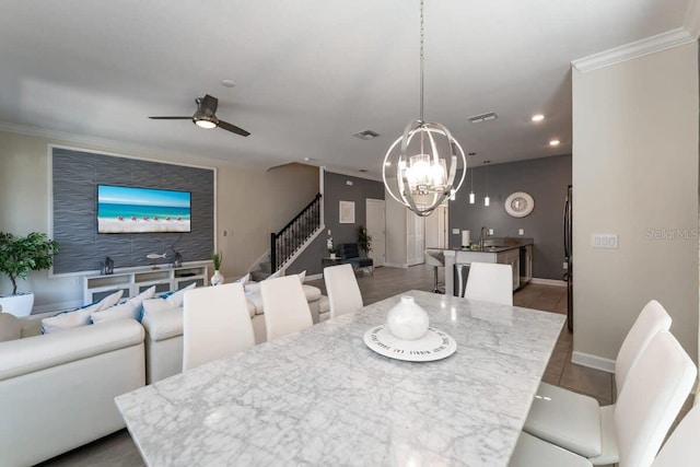 1264 Challenge Dr, Davenport, FL 33896 - dining room featuring stairs, a ceiling fan, recessed lighting, baseboards, and ornamental molding