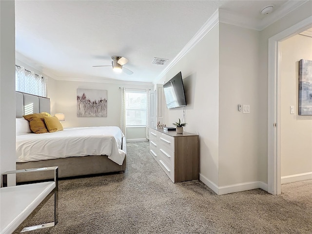 carpeted bedroom featuring ceiling fan and crown molding