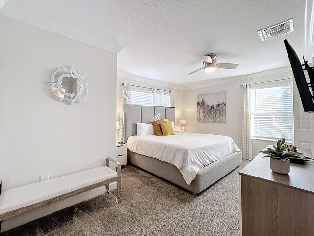 1264 Challenge Dr, Davenport, FL 33896 - carpeted bedroom with a ceiling fan, a textured ceiling, and crown molding