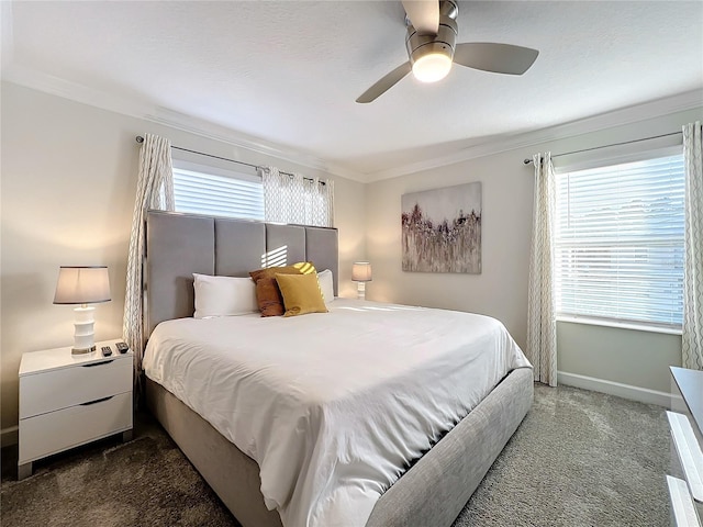 bedroom with ceiling fan, dark carpet, and crown molding