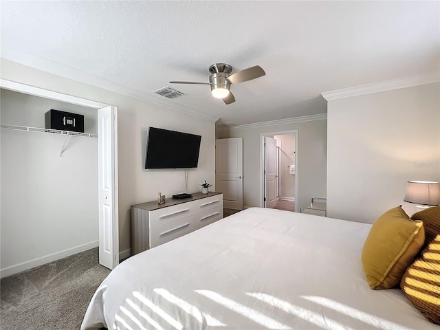 carpeted bedroom with ceiling fan, crown molding, and a closet