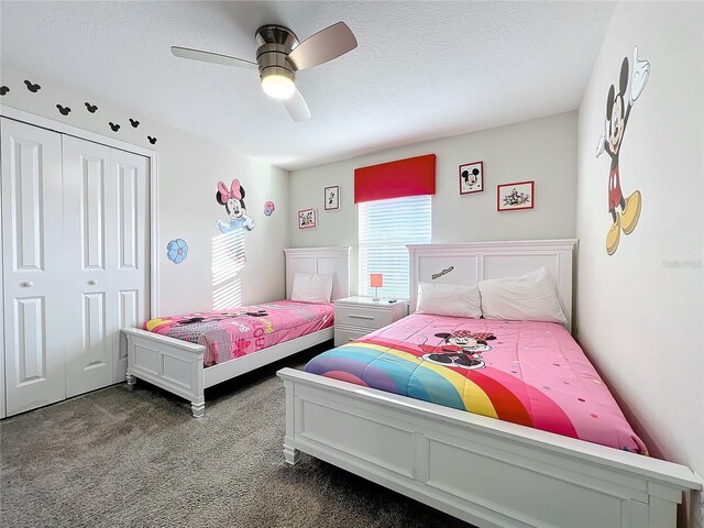 1264 Challenge Dr, Davenport, FL 33896 - carpeted bedroom featuring a closet, a textured ceiling, and ceiling fan