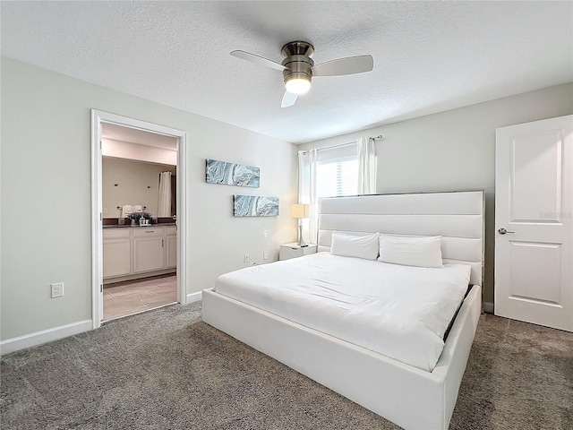 1264 Challenge Dr, Davenport, FL 33896 - bedroom with light colored carpet, ensuite bath, baseboards, a ceiling fan, and a textured ceiling