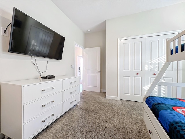 carpeted bedroom with a closet