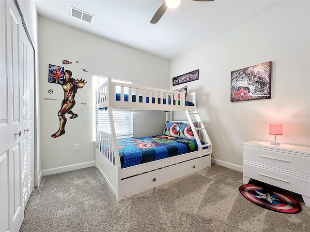 carpeted bedroom with a closet and ceiling fan