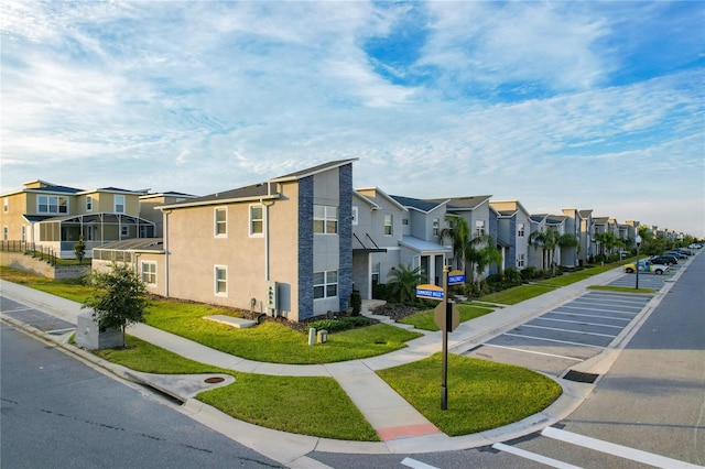 1264 Challenge Dr, Davenport, FL 33896 - view of building exterior featuring a residential view and uncovered parking