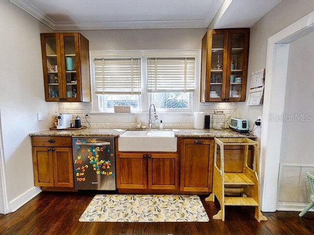 bar featuring backsplash, sink, stainless steel dishwasher, and dark hardwood / wood-style floors