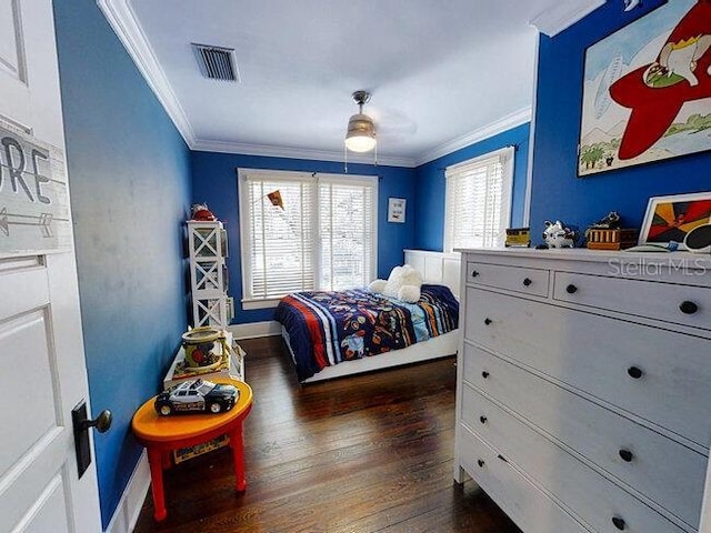 bedroom featuring ceiling fan, dark hardwood / wood-style flooring, and ornamental molding