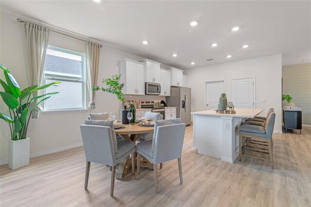 dining space featuring light hardwood / wood-style flooring