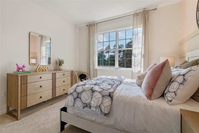 bedroom with light colored carpet