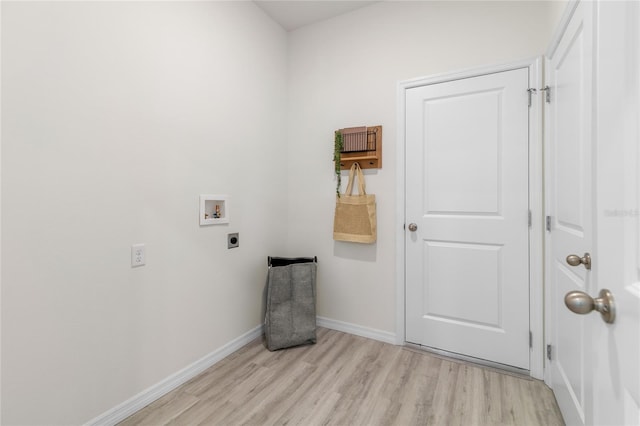 laundry area featuring hookup for a washing machine, electric dryer hookup, and light wood-type flooring