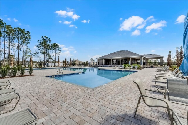 view of swimming pool with a patio area