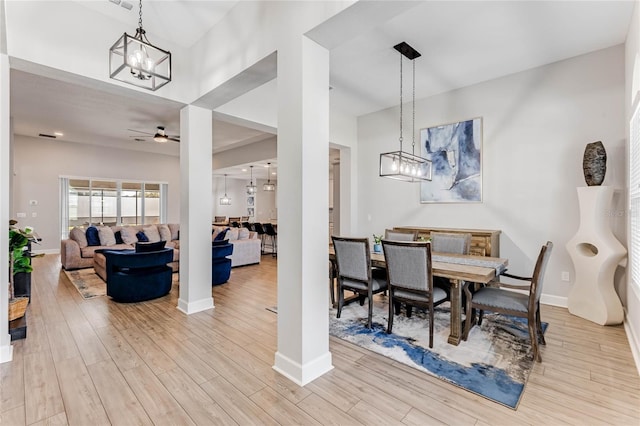 dining room with light hardwood / wood-style flooring and ceiling fan