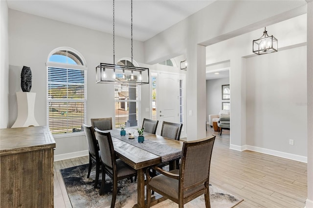 dining area featuring light wood-type flooring