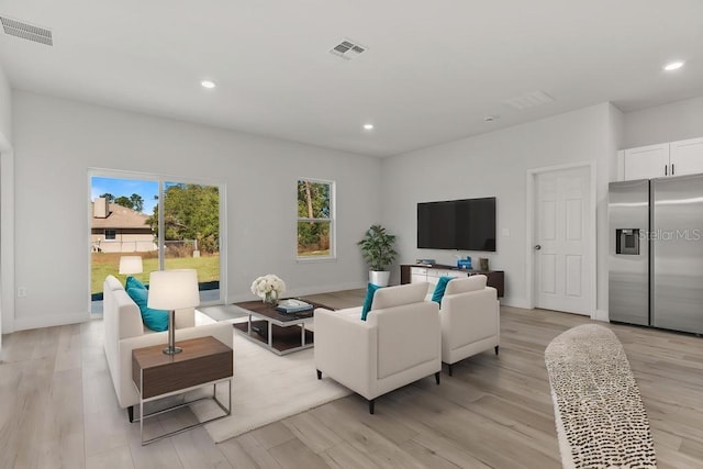 4479 SW 170th Rd, Ocala, FL 34473 - living room featuring recessed lighting, light wood finished floors, visible vents, and baseboards