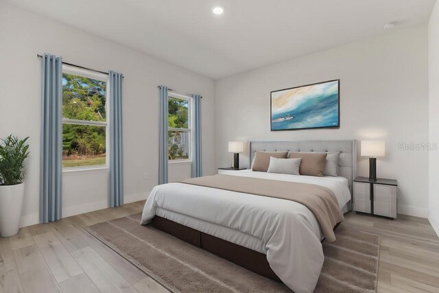 4479 SW 170th Rd, Ocala, FL 34473 - bedroom with light wood-style flooring, recessed lighting, and baseboards