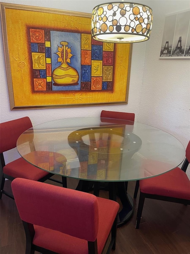 dining area with hardwood / wood-style floors