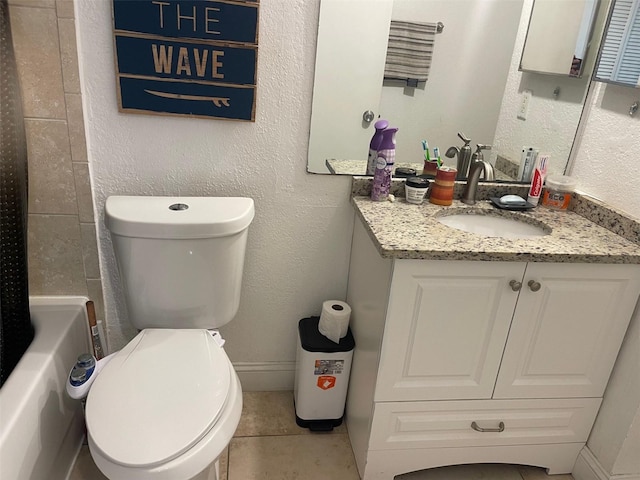 bathroom with tile patterned floors, vanity, and toilet