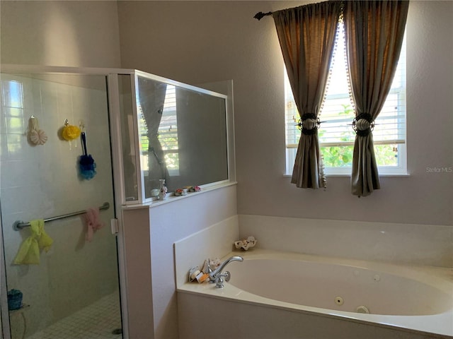 bathroom with separate shower and tub