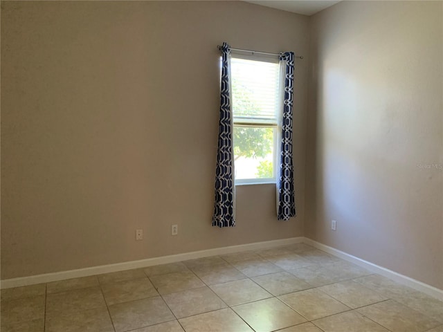 spare room with light tile patterned floors