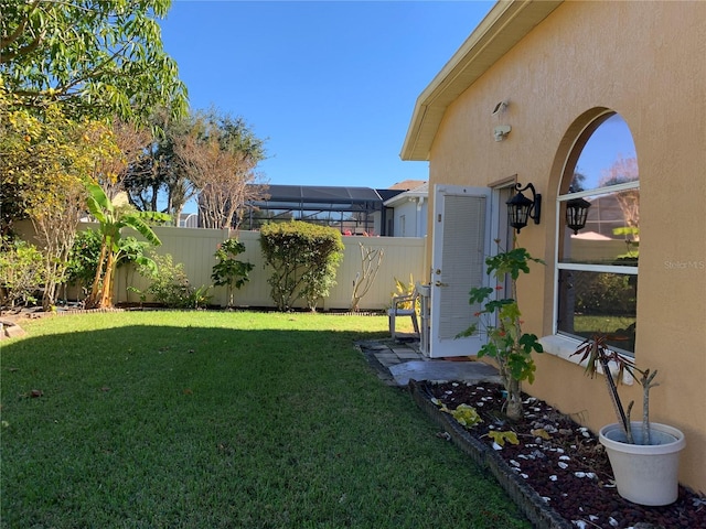 view of yard with glass enclosure