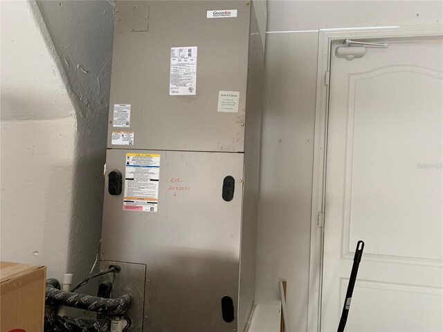 utility room with heating unit