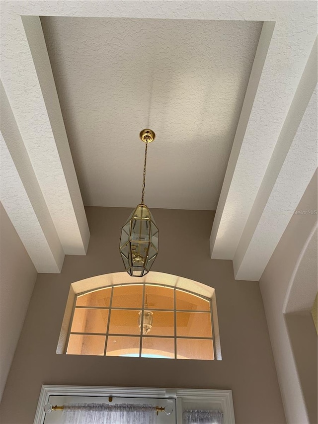 details with a textured ceiling