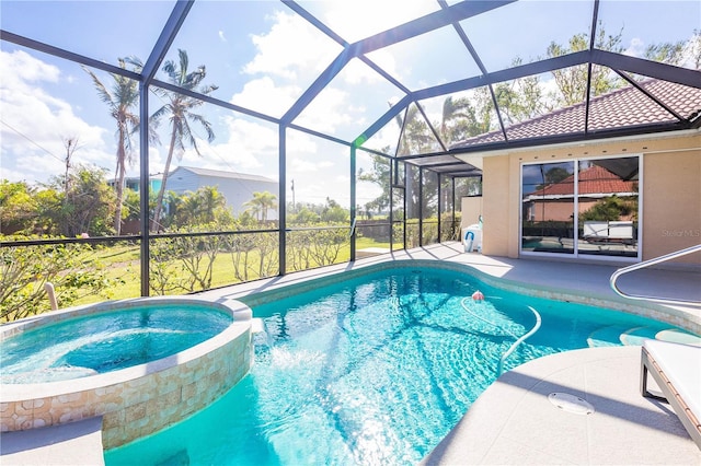 view of swimming pool with glass enclosure and a patio