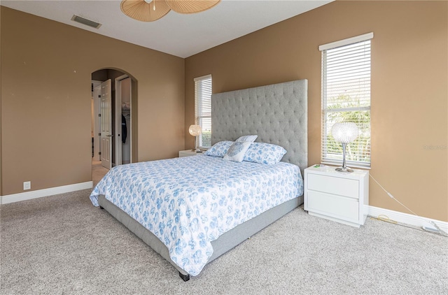 carpeted bedroom featuring ceiling fan