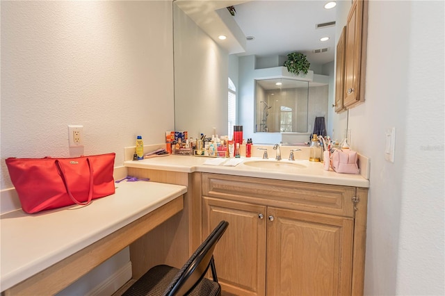 bathroom with vanity and walk in shower