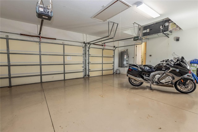 garage with a garage door opener and water heater